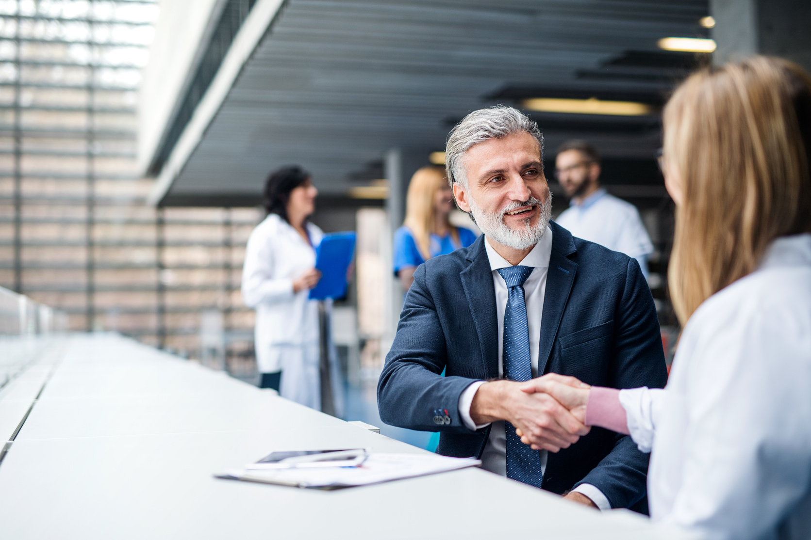 Sales associate meeting a client